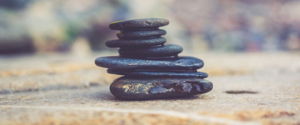 Stacked rocks to symbolize choosing your marketing mix 